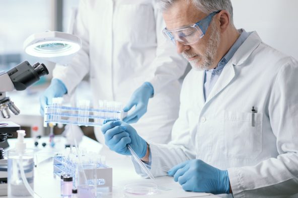 Scientist conducting an experiment in a laboratory, focusing on phage solutions for antibiotic-resistant bacterial challenges.